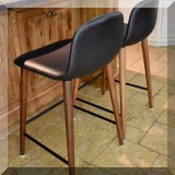 F19. Pair of Mode Jobs leather bar stools. 26”h 
